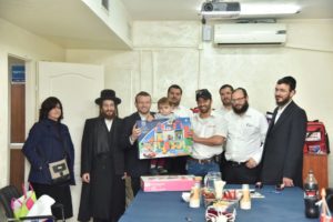 Chaim, the child who survived nearly choking to death celebrates with his family and the staff of United Hatzalah, the organization who's first responder saved his life in 90 seconds. 