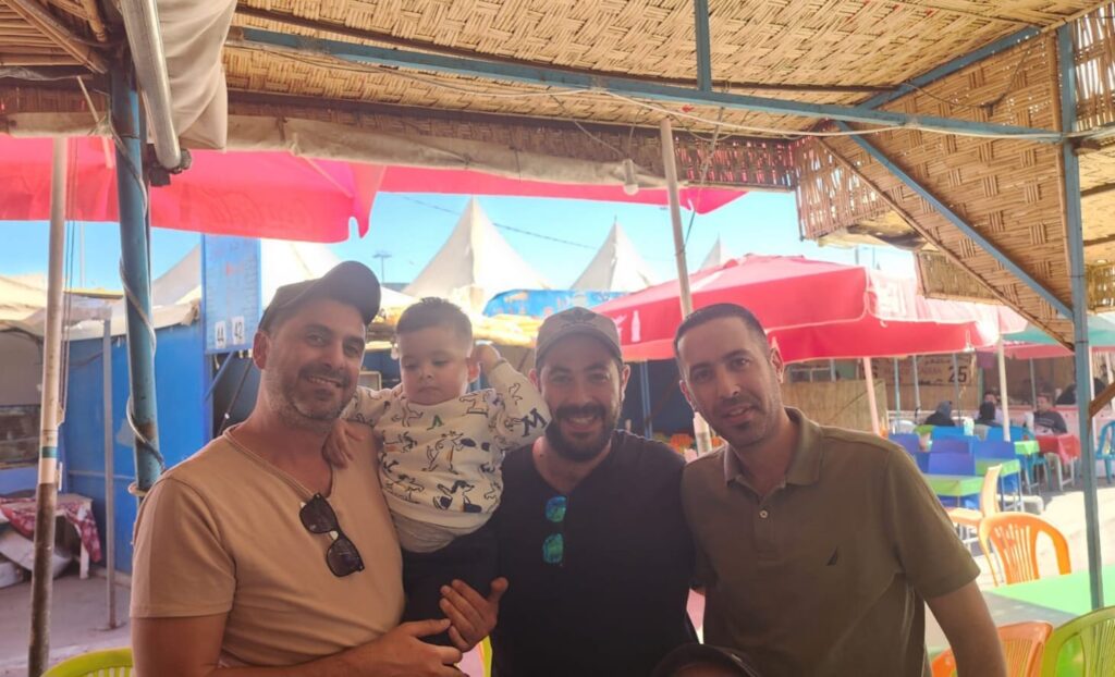 From right to left Moshe the baby they saved Nati and Itzik Asoulin 1024x622 1