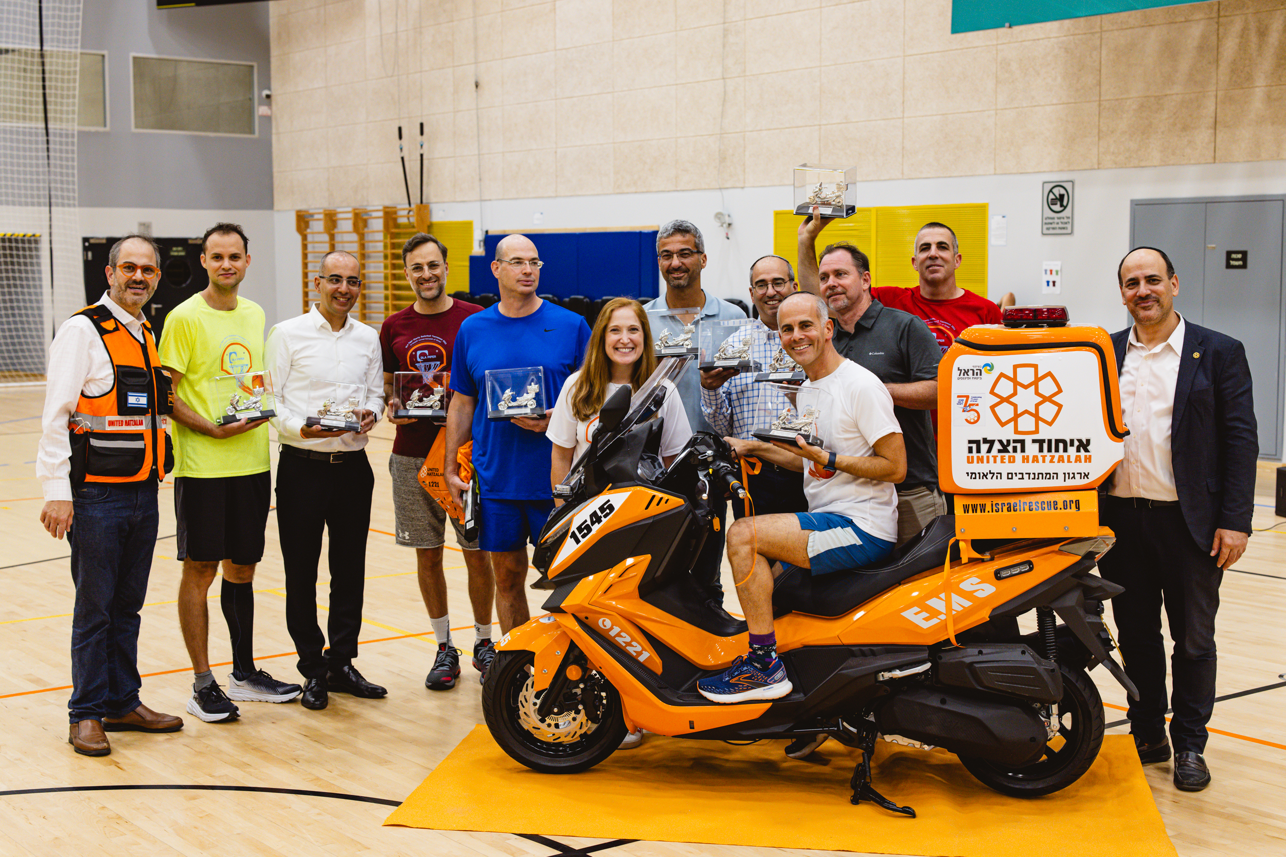 Naomi Maryles Jeremy Lustman on the ambucycle Eli Beer left Eli Pollak right and the partners from the participating l 1