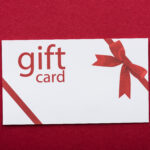top view of gift card on red background 2024 11 10 23 52 58 utc