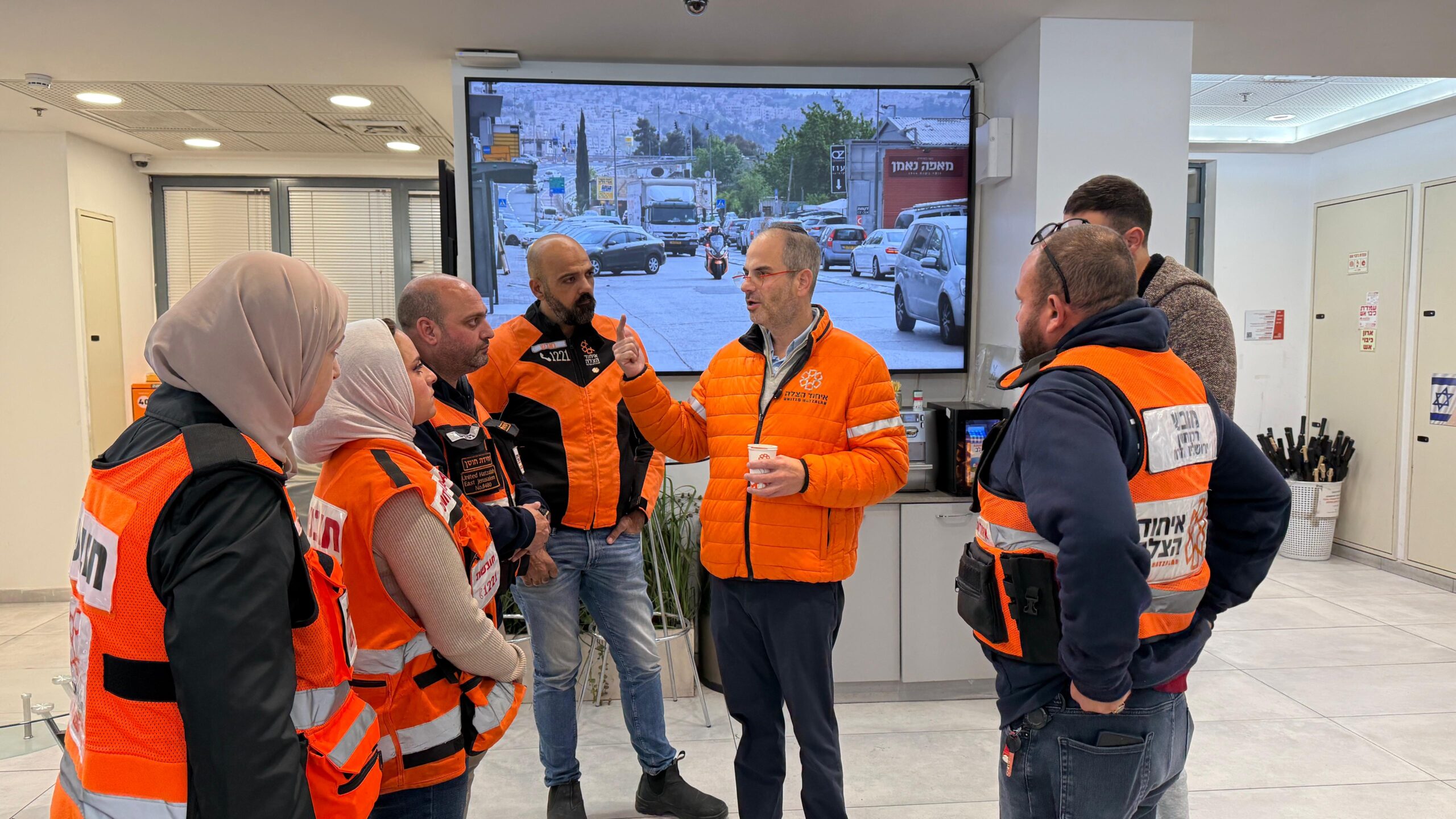 United Hatzalah President Eli Beer with volunteer EMTs at the Jerusalem based headquarters