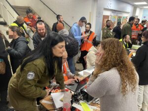 United Hatzalah Medic Linor Attias at the scene of an impact site caring for those affected.