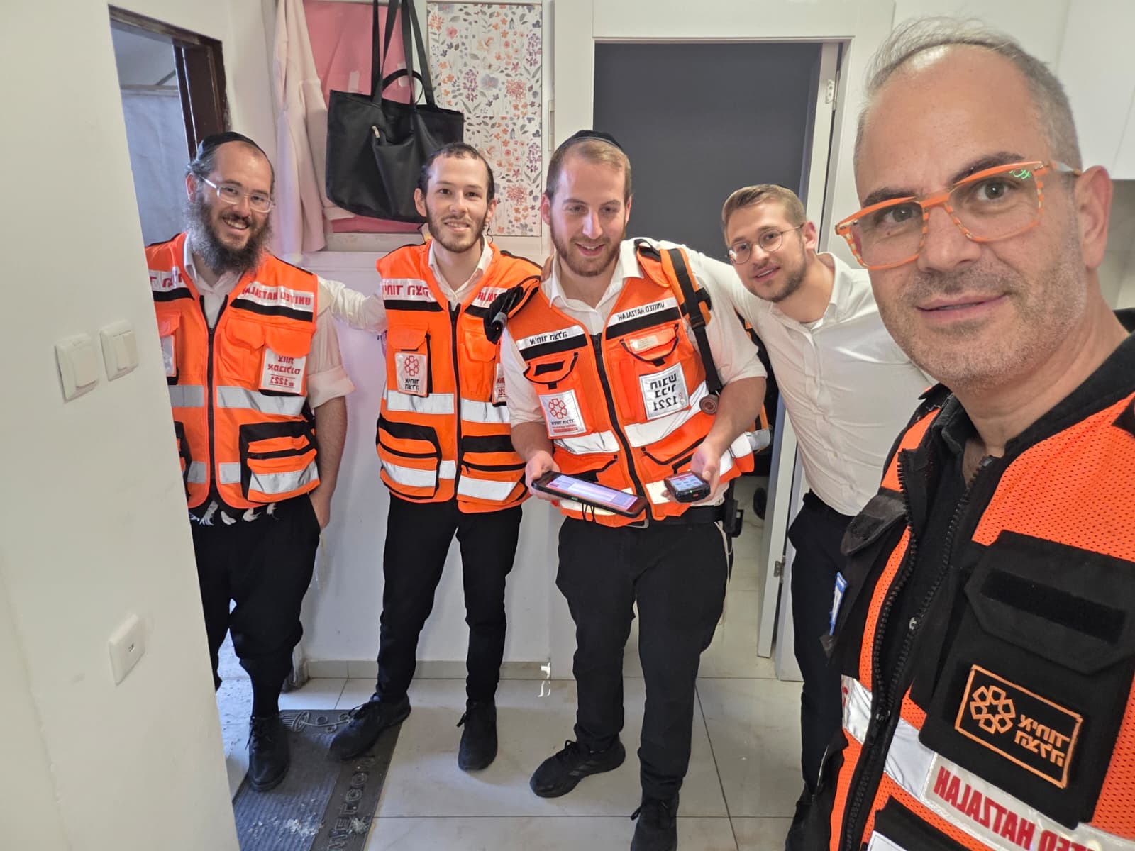 United Hatzalah Founder and President Eli Beer with volunteers who provided lifesaving care to a choking baby in Jerusalem