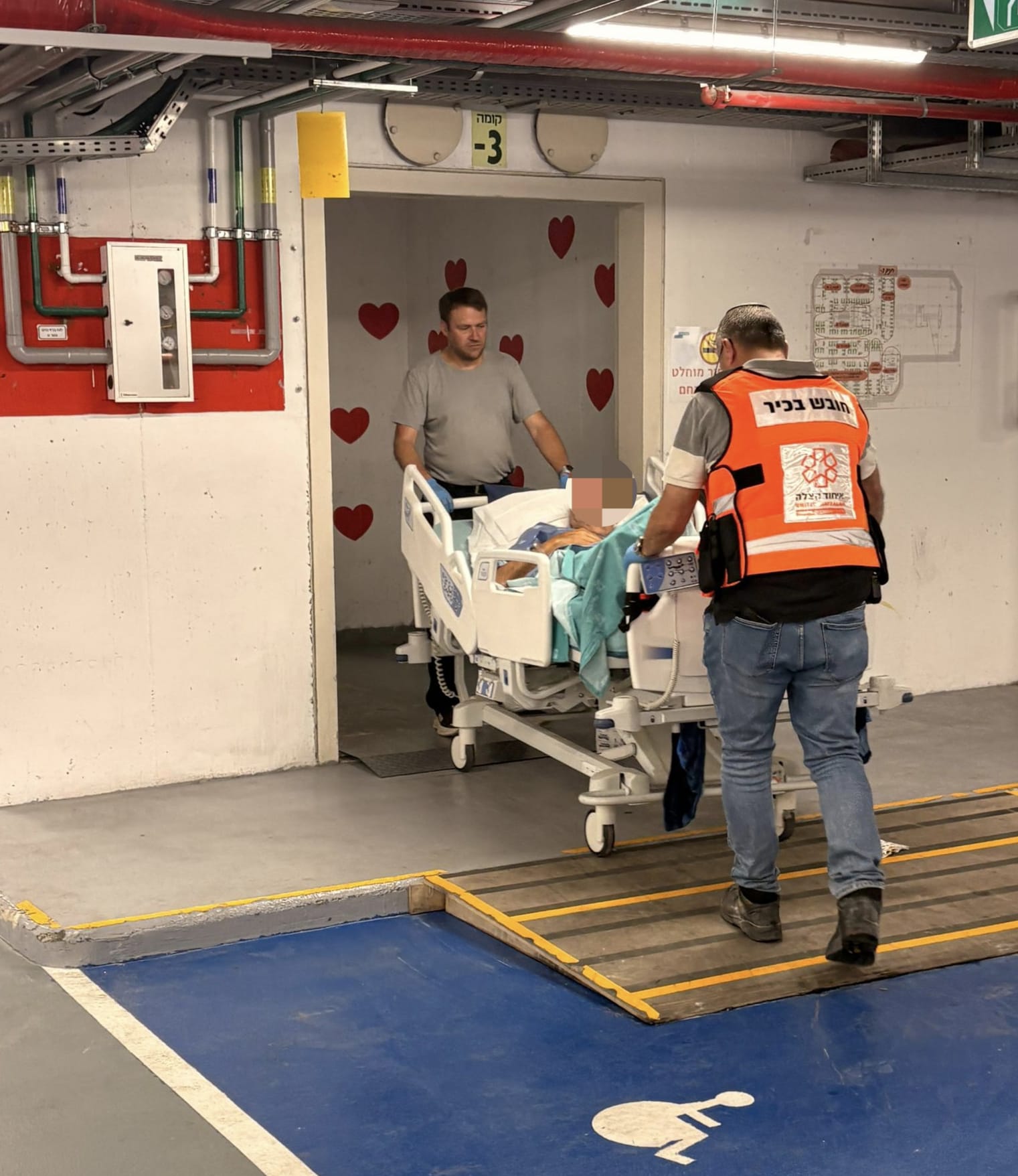 United Hatzalah volunteer helps transport patients to the underground protected facilities