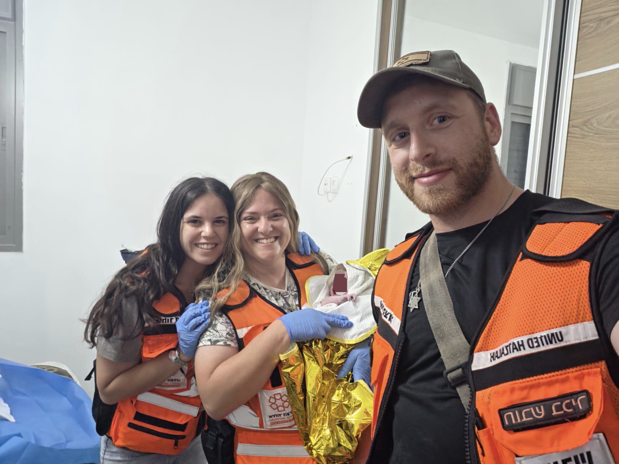 United Hatzalah volunteer EMTs Hila Rinkoff, Shira Silverman and Akiva Pudell after delivering a baby in Carmei Gat