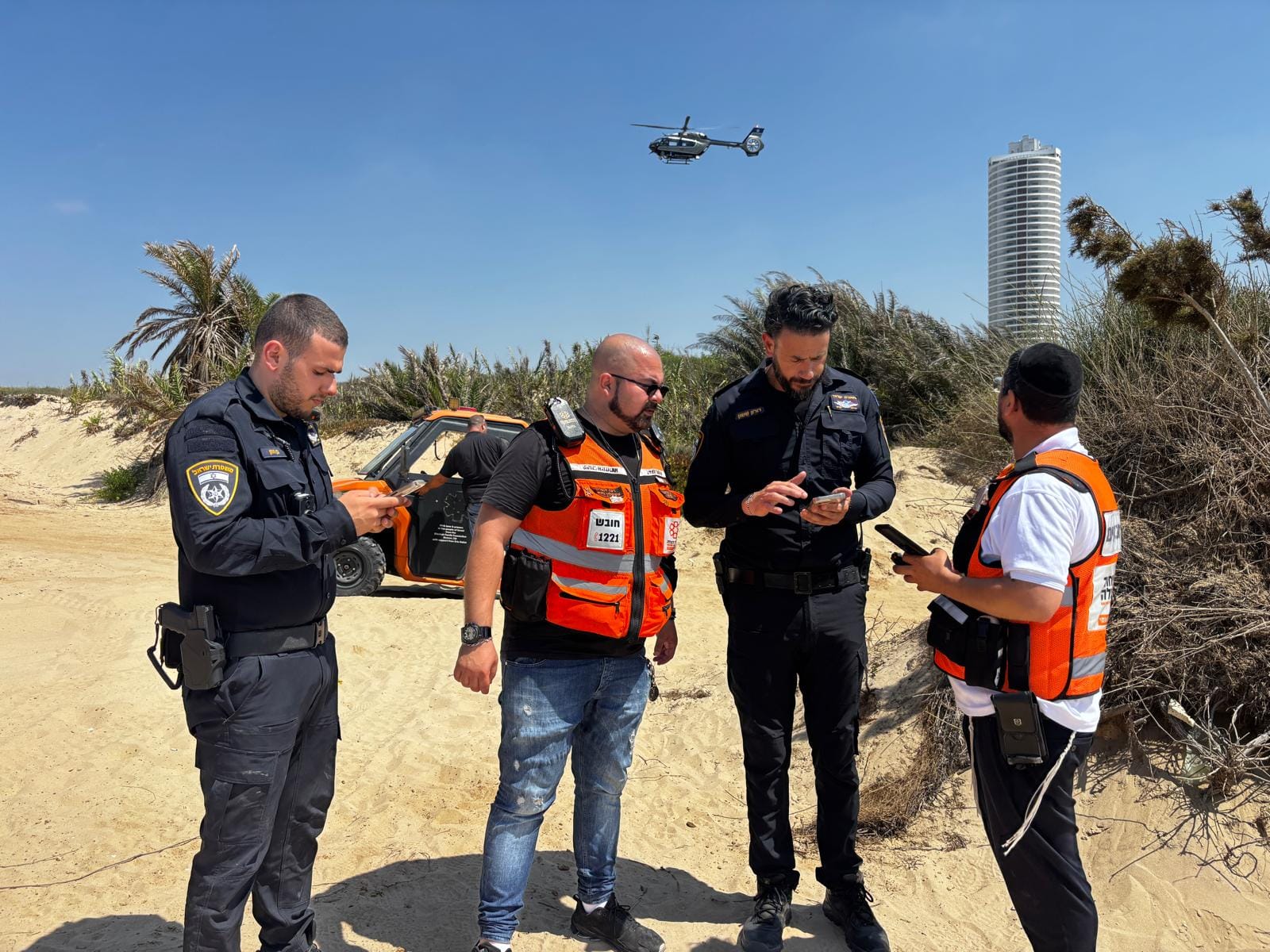 United Hatzalah Volunteers with Israeli Police on the beach searching for missing 4-year-old Yuval Kogan