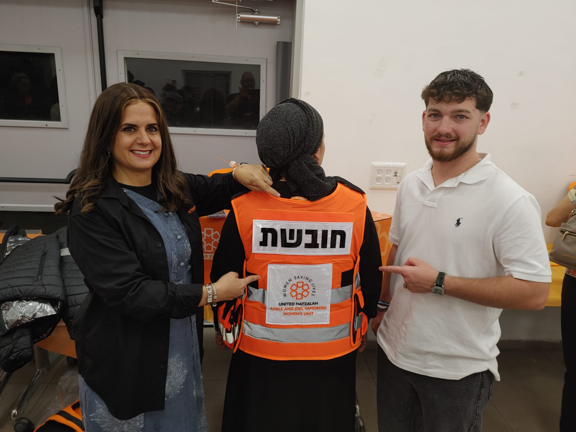 United Hatzalah Women's Unit Manager Karen Arielli and former hostage Bar Kupershtein with his mother Julie who recently completed a United Hatzalah medic training course