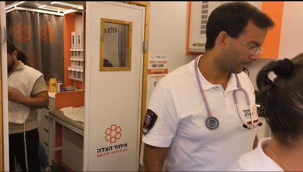 Dr. Nathan Ungar providing care to a patient in the Ruderman Mobile Emergency Care Clinic