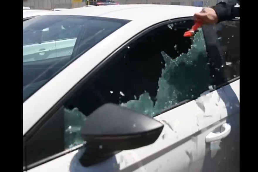 Police smashed this window to rescue a baby after being left insiide the car in the Yavne Train Station